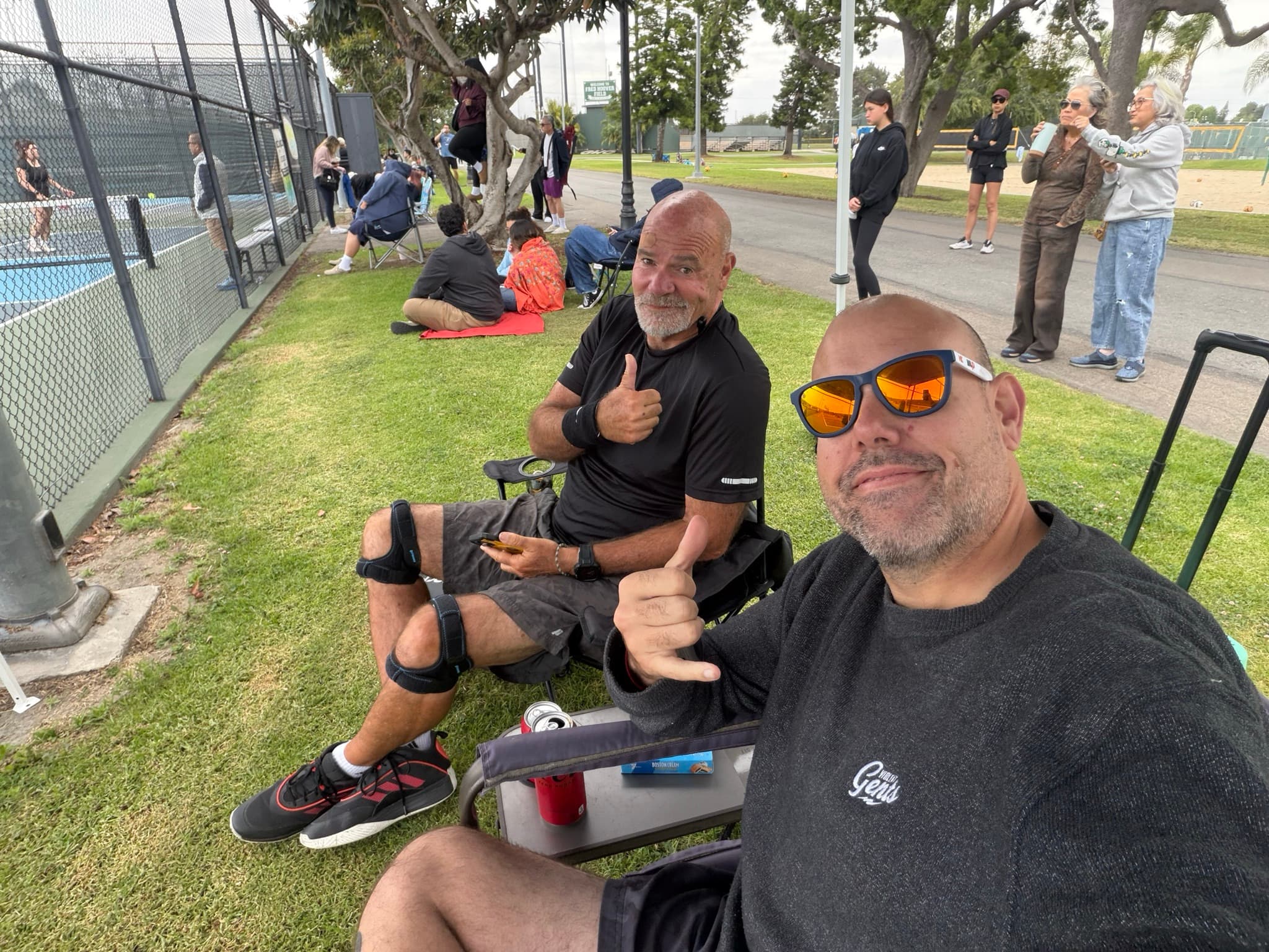 Tim and Paul Baker courtside between matches at a tournament